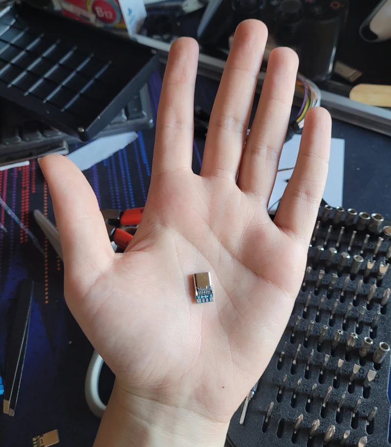 The tiny USB-C breakout board compared to my hand